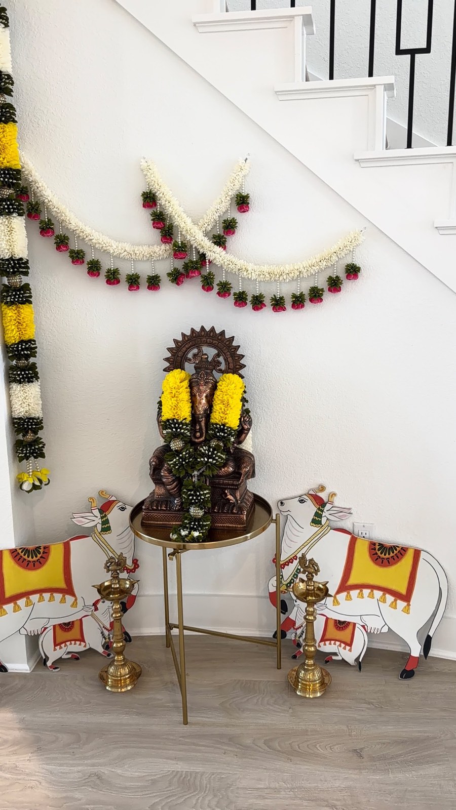 Ganesha Pooja Corner with Garlands and Lamps