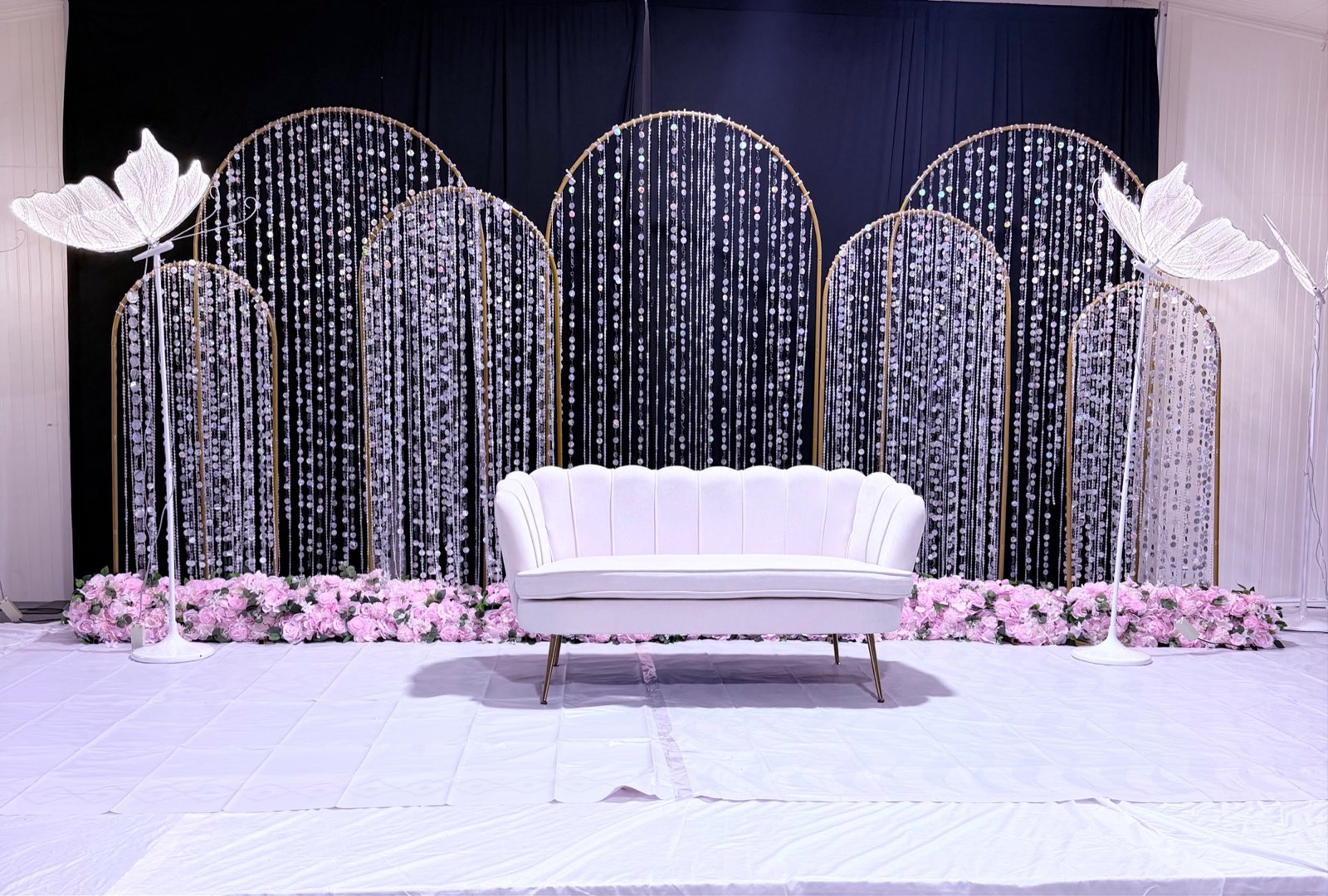 Sangeet Night Stage with Sequin Arches and Butterflies